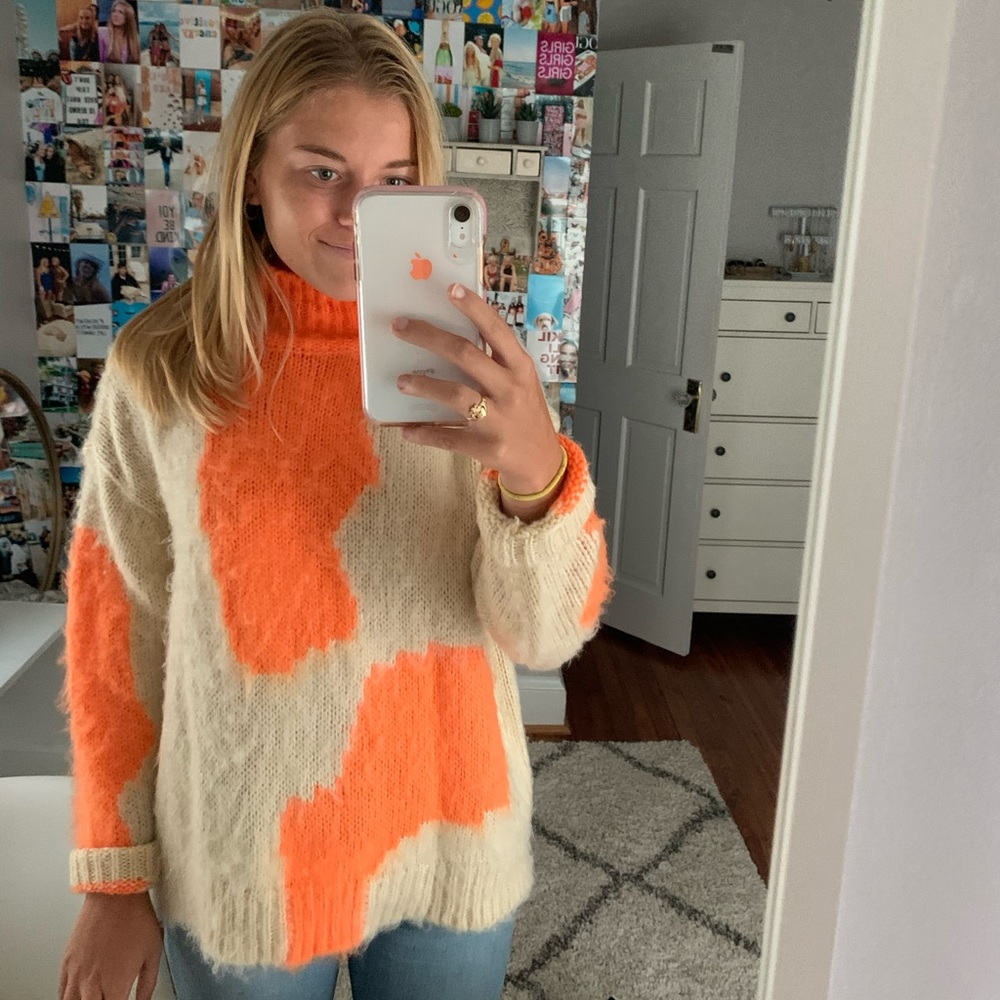 Orange and cream turtleneck sweater